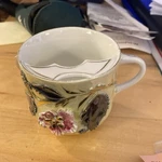German Porcelain Embossed Floral Mustache Cup 12OZ Painted Gold Trim Decorated. Fixed Price $10.00.