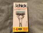 New Schick Quattro Titanium Razor And 4 Refill Cartridges. Fixed Price $13.91.