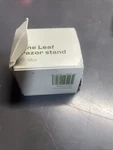 The Leaf Razor Stand, Silver. Fixed Price $24.99.