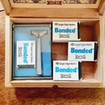 Vintage Wilkinson Sword Bonded Razer With Six Blade Sets New Cigar Box. Fixed Price $190.00.