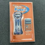 Gillette Fusion Shaver Razor Handle W/ 6 Of The Blade Refill Cartridges, 2005. Fixed Price $74.99.