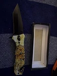 Leopard Handle Tactical Spring Assisted Serrated Tanto Blade Folding Knife. Fixed Price $12.50.